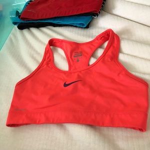 Medium red/orange/pink Nike bra